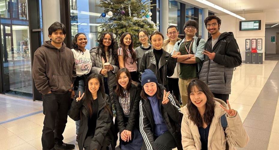 Group of smiling students dressed in warm clothes