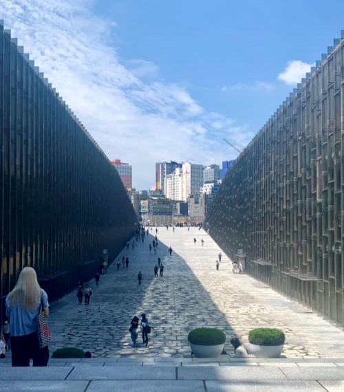 Ewha Womans University with the buildings in the city behind it on a sunny day