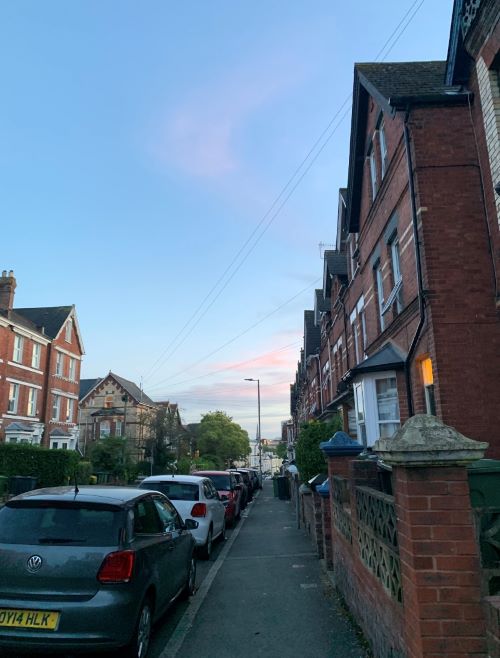 An Exeter city street at sunset