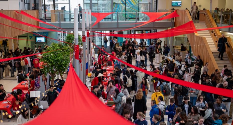 Streatham Campus's Forum building filled with Spring Festival decorations and students celebrating