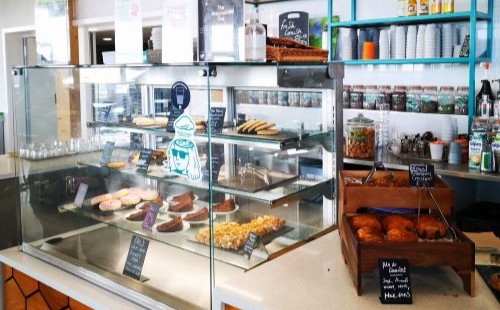 Café counter displaying baked goods