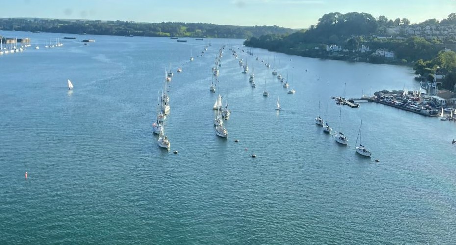 Aerial view of boats in lines in Falmouth harbour on a sunny day