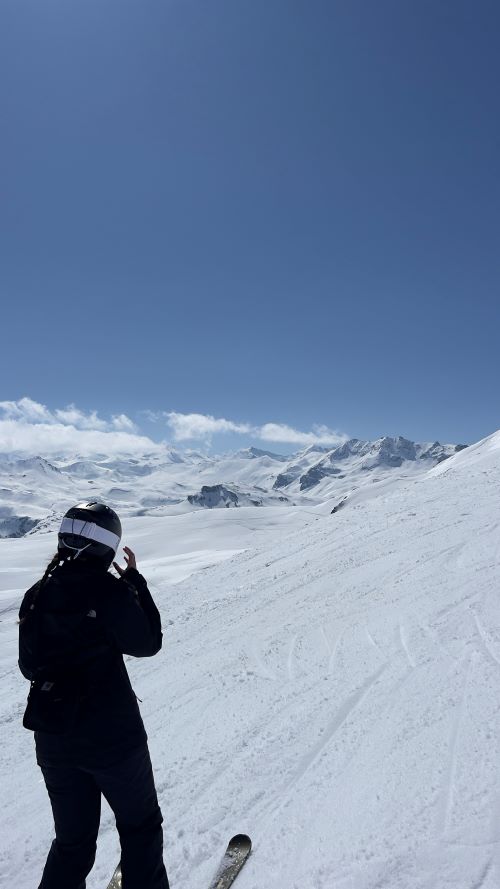 Student in ski kit on a snow covered mountain