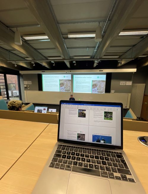 Laptop on a desk in a lecture theatre