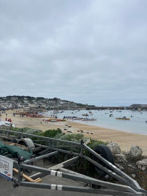 View of a gig rowing competition taking place in a bay