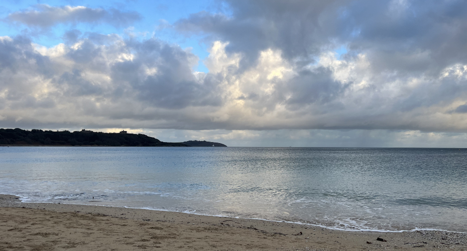Cloudy sky over a flat sea