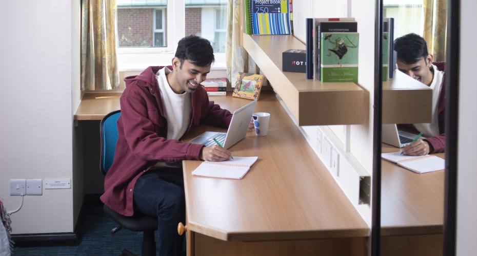 photo of Brian studying at a desk