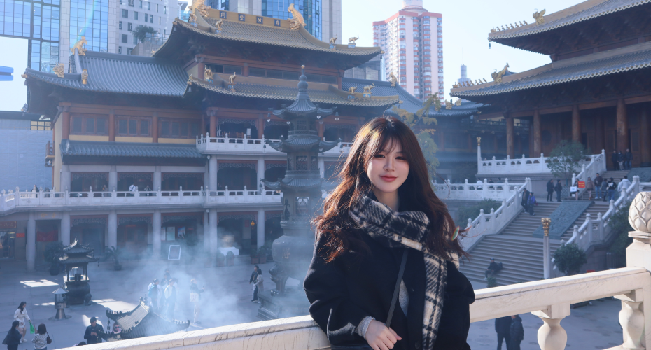 photo of Khanh Ha in front of a pagoda