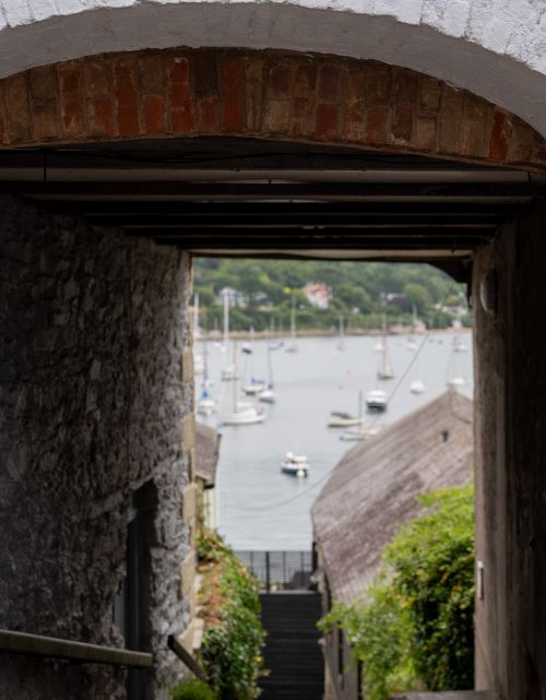 View of Falmouth Harbour taken through a stone arch