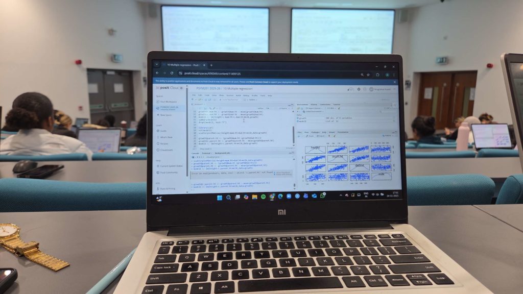 A photo of a student's laptop with complex statistics work on