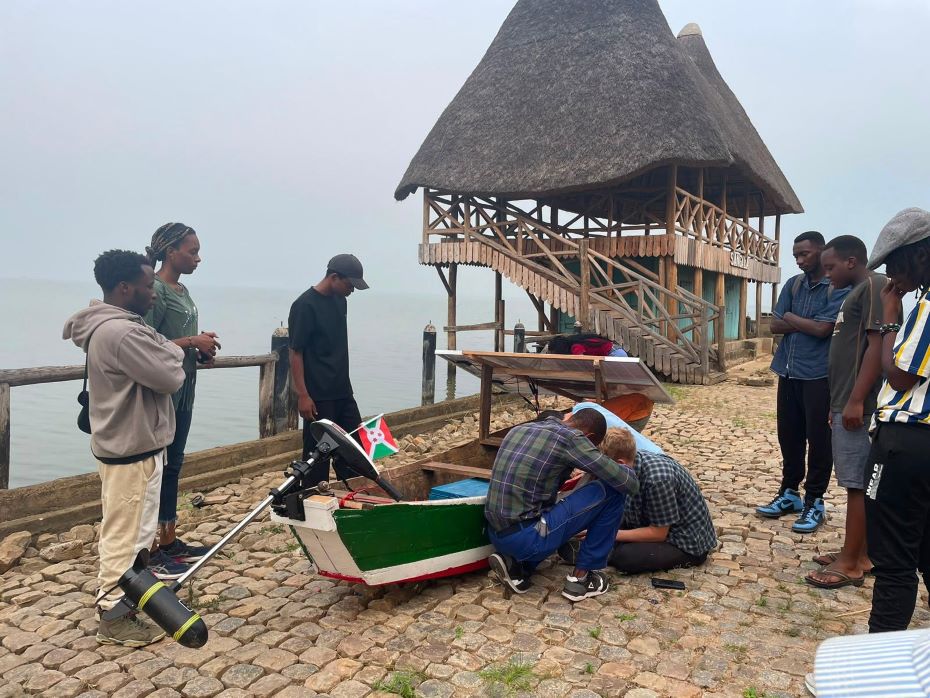 Josh and local students and fishermen working on the boat